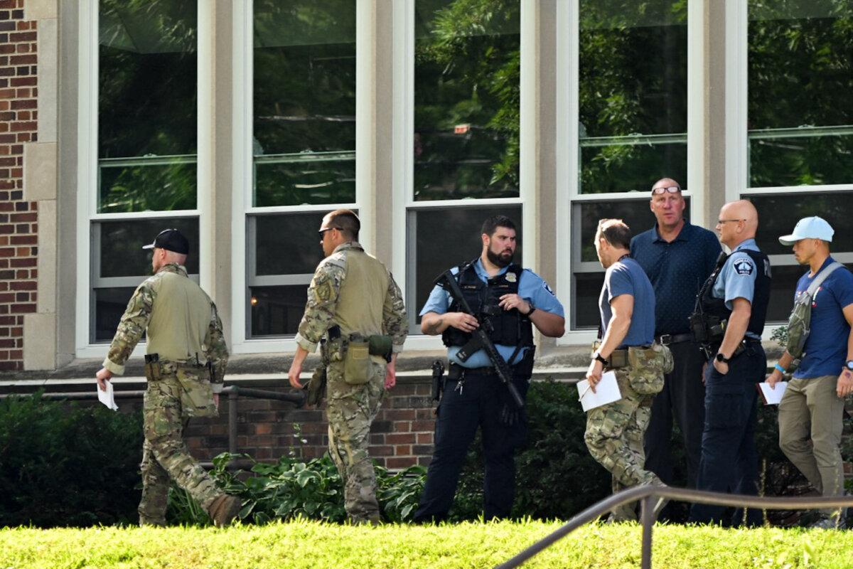 Law enforcement officers work at the scene of a shooting at Annunciation Catholic School in Minneapolis on Aug. 27, 2025, in this file photo. (Tom Baker/AFP via Getty Images)
