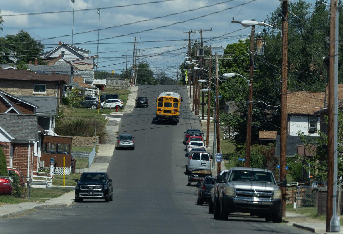 A school bus travels near Petersburg High School in Petersburg, W.Va., on Aug. 27, 2025. (John Fredricks/The Epoch Times)