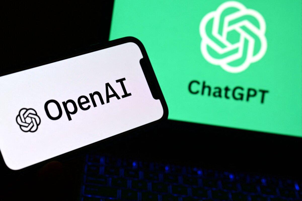 A photo shows a smartphone and a laptop displaying the logos of the OpenAI research laboratory and ChatGPT robot in Manta, near Turin, Italy, on Oct. 4, 2023. (Marco Bertorello/AFP via Getty Images)