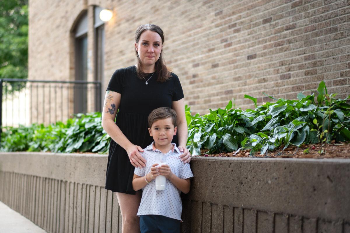 In the aftermath of the Annunciation Catholic community school shooting in Minneapolis, Mary Perez and her son, Felix, attend an interfaith prayer service at the Basilica of Saint Mary in Minneapolis on Aug. 28, 2025. (Madalina Kilroy/The Epoch Times)