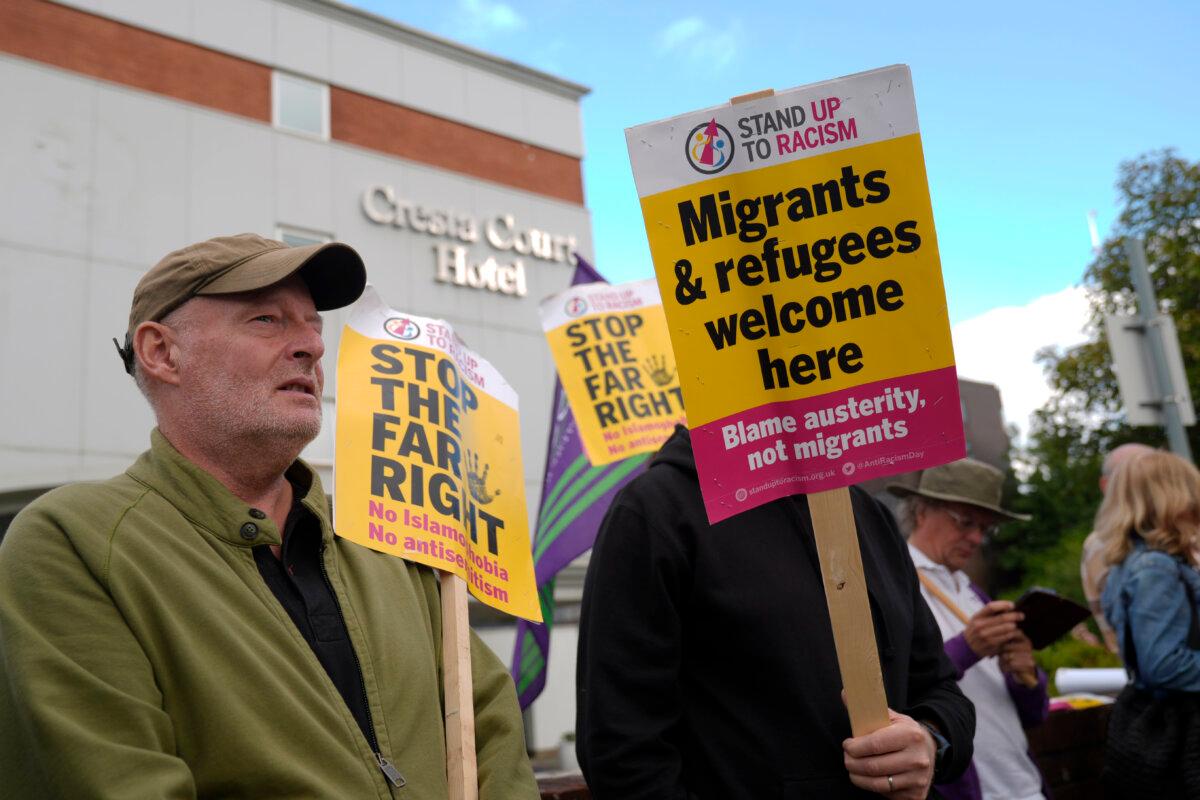 Protesters take part in the "Defend Refugees, Stand Up To Fascism" rally, organized by Stand Up to Racism, near the Cresta Hotel in Altrincham, Cheshire, on Aug. 8, 2025. (Danny Lawson/PA)