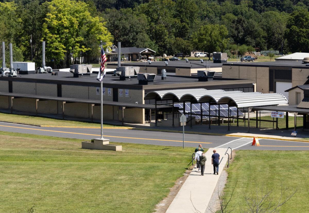 Students walk near Petersburg High School in Petersburg, W.Va., on Aug. 27, 2025. (John Fredricks/The Epoch Times)