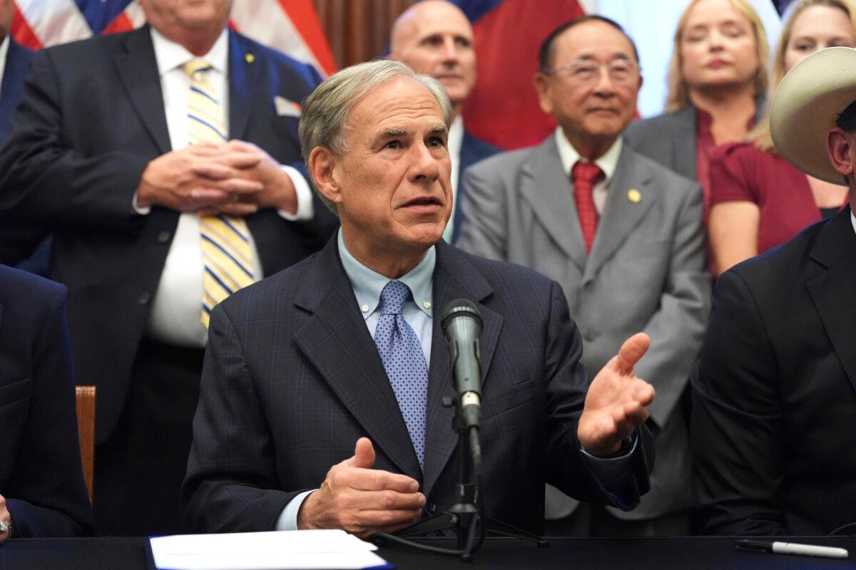 Texas Gov. Greg Abbott speaks to the media following a bill signing as Texas senators debate a bill on a redrawn U.S. congressional map during a special session in the Senate Chamber at the Texas Capitol in Austin on Aug. 22, 2025. (Eric Gay/AP Photo)