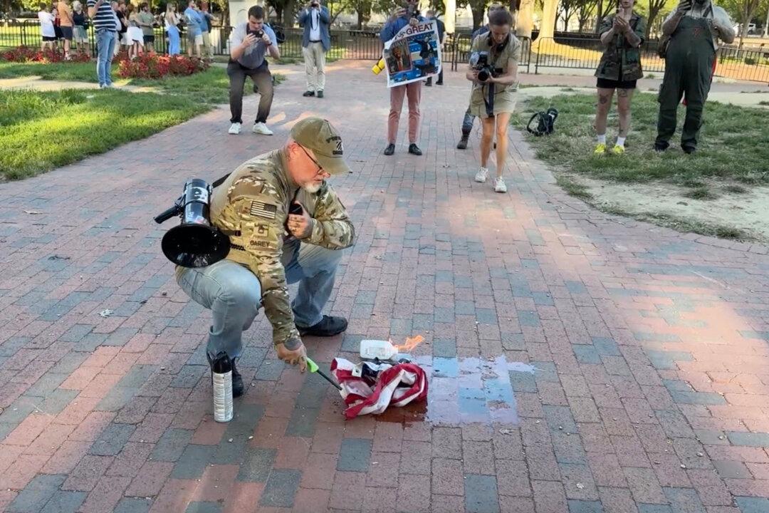 DOJ Charges Man Who Burned US Flag in Protest of Executive Order