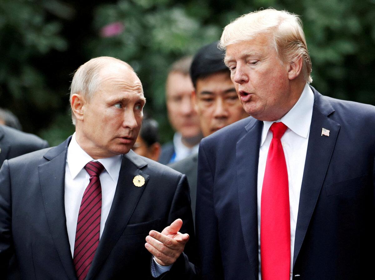Trump Heads to Alaska for Pivotal Summit With Putin on Ukraine War 2 U.S. President Donald Trump and Russian President Vladimir Putin talk during the family photo session at the APEC Summit in Danang, Vietnam, on Nov. 11, 2017. (Jorge Silva/Reuters)