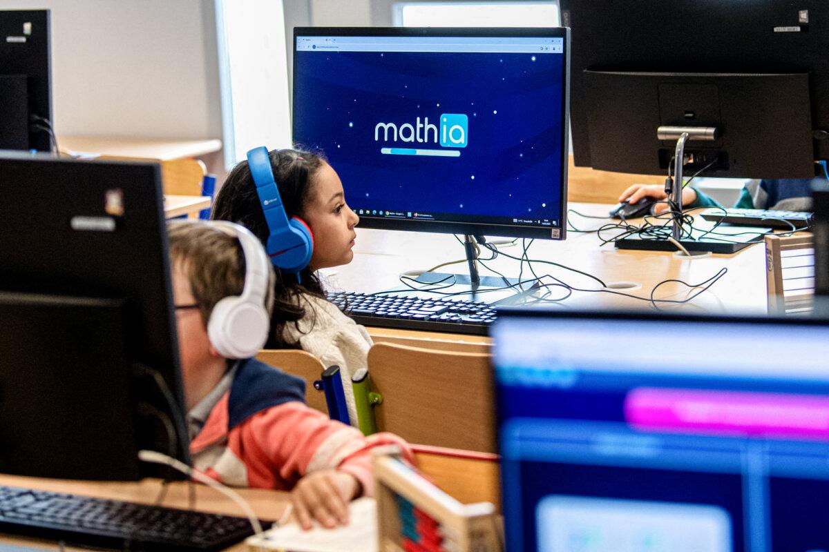 Pupils in a primary school class use AI for math lessons in Colomiers, France, on March 14, 2025. (Matthieu Rondel/AFP via Getty Images)