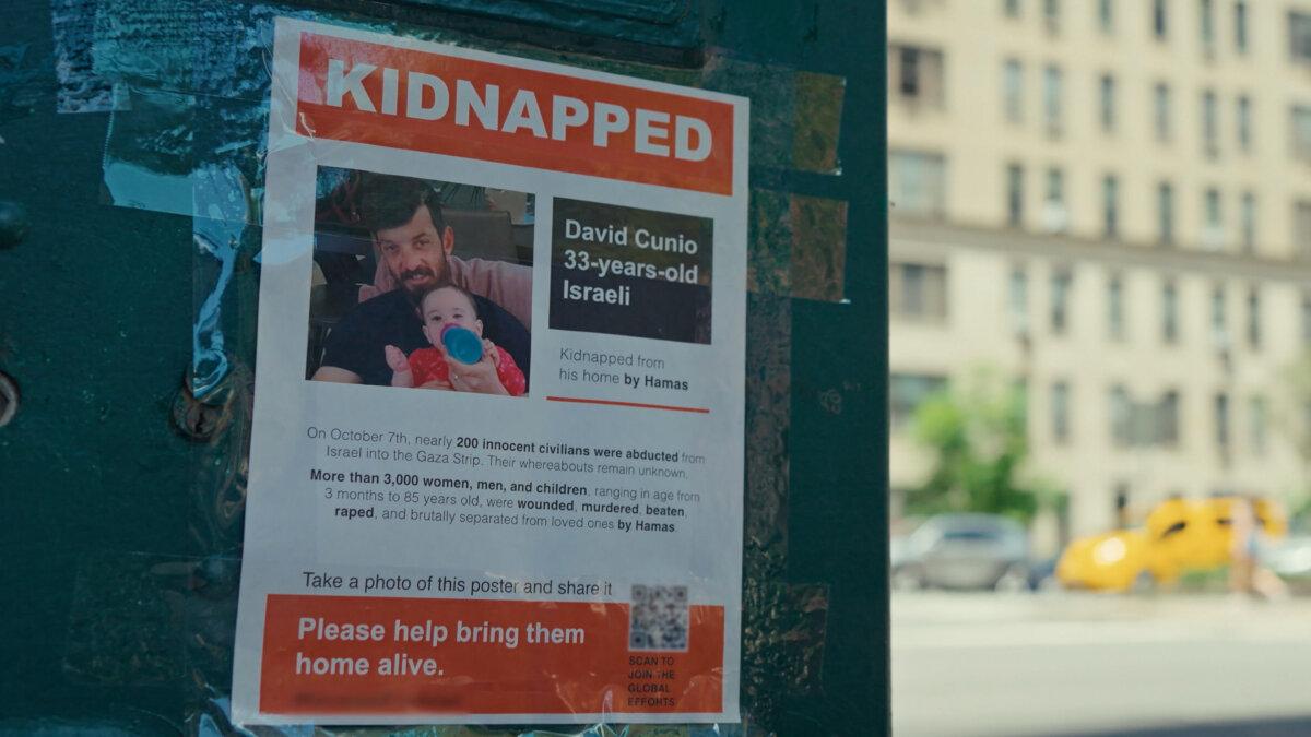 A poster of Gaza hostage in New York City, in "Torn." (Nim Shapira)