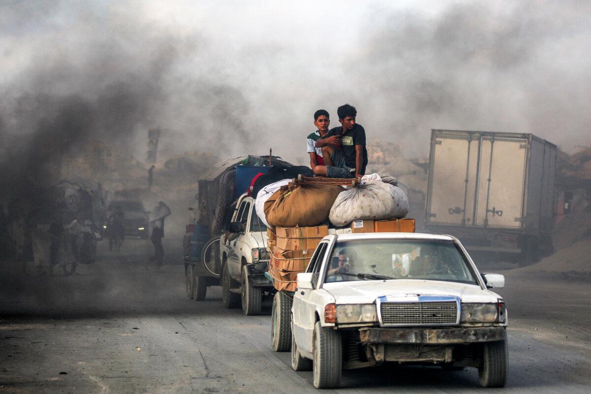 UAE Officials Say West Bank Annexation by Israel Would Threaten Abraham Accords 2 Youths ride atop packages and furniture in a cart towed by another vehicle as people evacuate southbound from Gaza City on Sept. 2, 2025. (Eyad Baba/AFP via Getty Images)