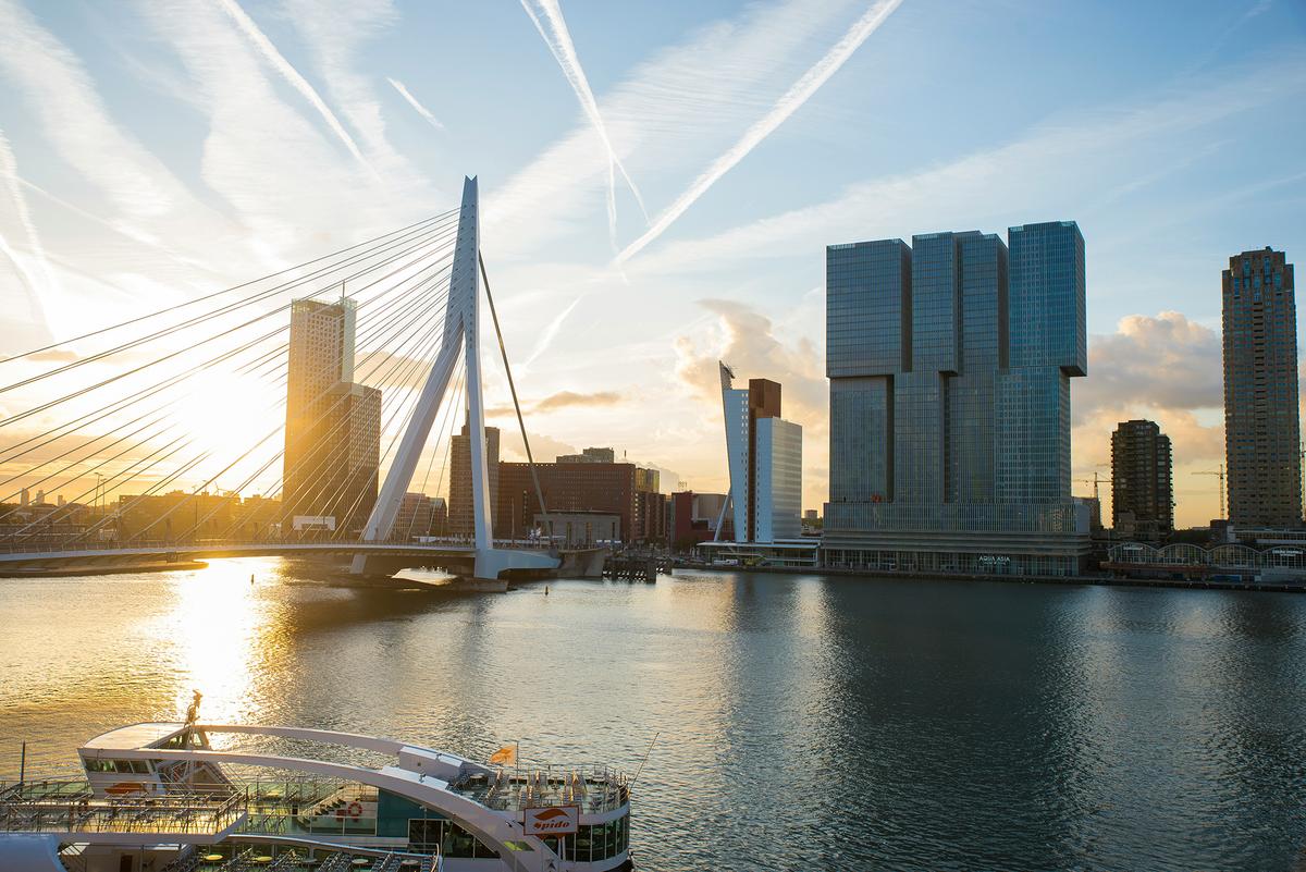 The Erasmus Bridge, nicknamed "The Swan" for its elegant design, spans the Nieuwe Maas River. (Daniel Agudelo/Unsplash)