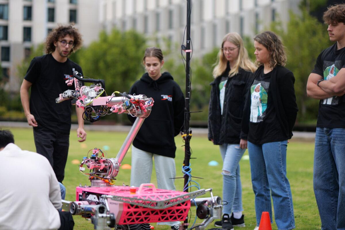 The NISA 2025 cohort interacting with the Monash Nova Rover (Courtesy of Monash University).