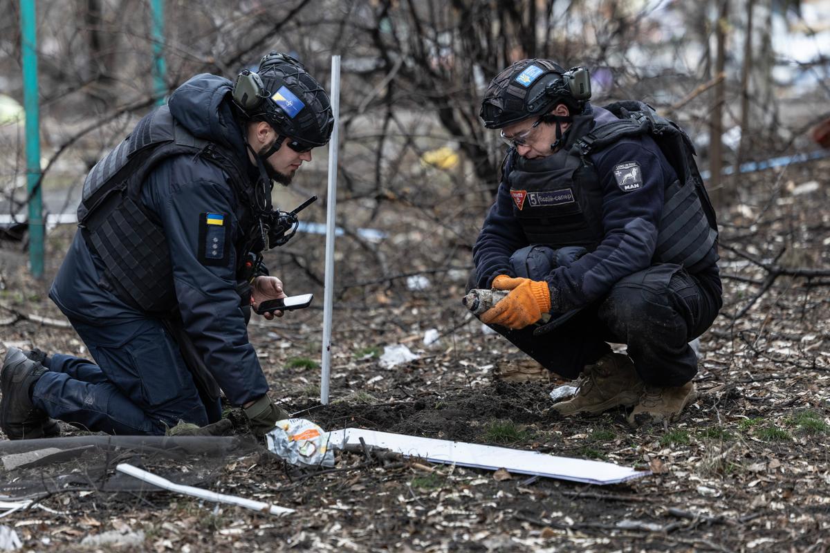 Ukrainian deminer team works on the scene after a large scale Russian in Dobropillia, Ukraine, on March 10, 2025. (Paula Bronstein / Getty Images)