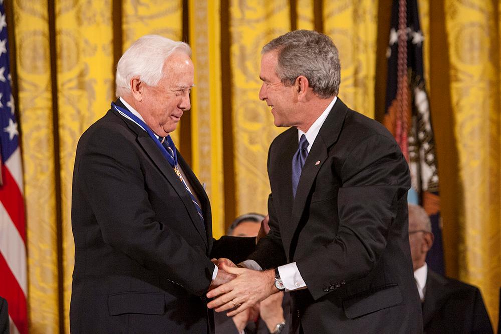 President George W. Bush presents David McCullough with the Presidential Medal of Freedom on Dec. 15, 2006, during ceremonies in the East Room of the White House. George W. Bush Presidential Library and Museum. (Public Domain)