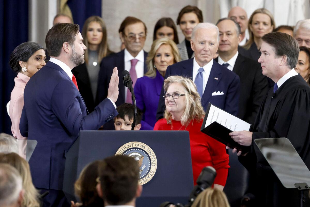 Justice Brett Kavanaugh (R) administers the vice presidential oath of office to JD Vance (2nd L) as Vance's mother, Beverly Aikins (3rd R), and President Joe Biden (2nd R) look on during an inauguration ceremony in the U.S. Capitol rotunda on Jan. 20, 2025. (Shawn Thew-Pool/Getty Images)