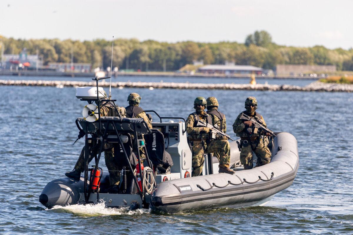 Bundeswehr units secure the harbor with an inflatable boat during the Quadriga 2025 military exercises in Rostock, Germany, on Sept. 4, 2025. (Maja Hitij/Getty Images)