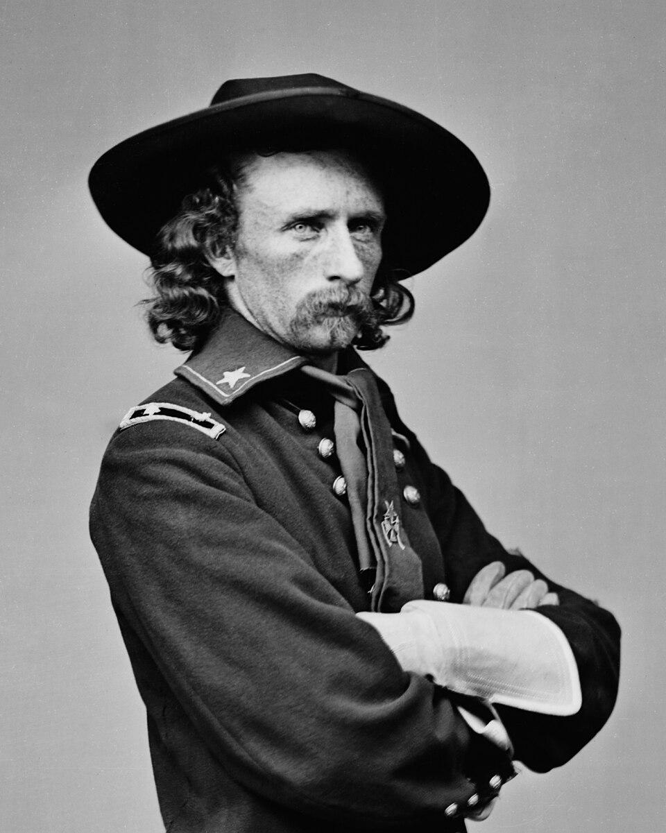 Brevet Maj. Gen. George Custer in his field uniform. 1865. Photographed by Matthew Brady. (Public Domain)