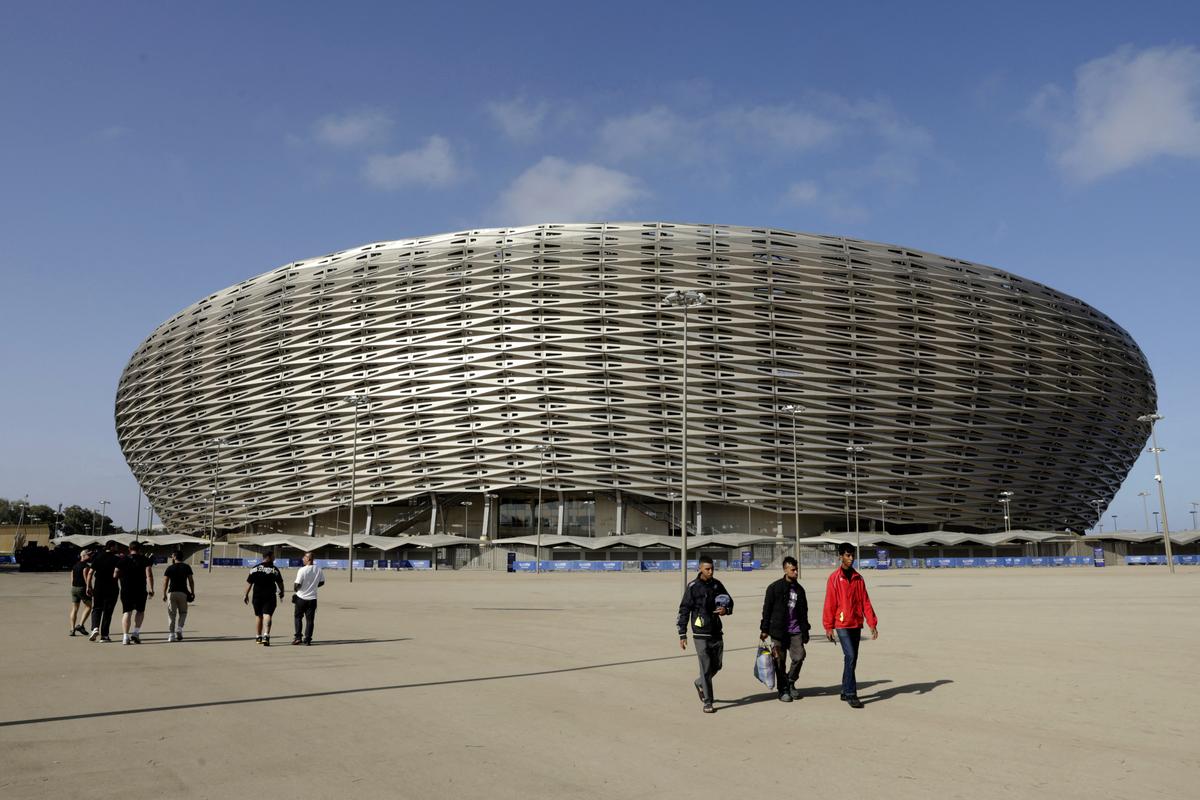 People walk near the new Prince Moulay Abdellah Stadium in Rabat, which was completely demolished in 2023 and rebuilt according to the latest international standards, in Rabat, Morocco, on Sept. 5, 2025. (Abdel Majid Bziouat/AFP via Getty Images)