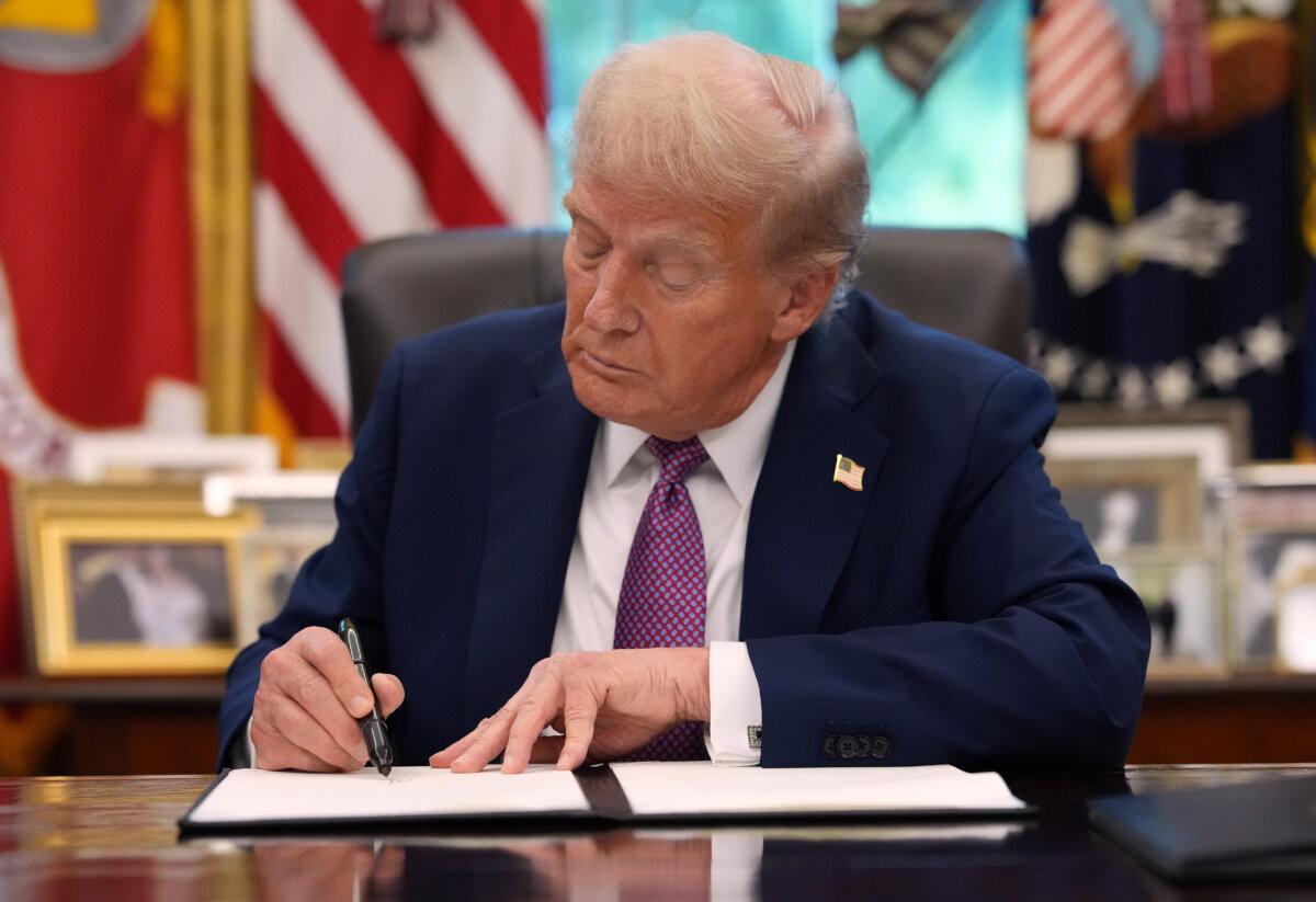President Trump signs an executive order in the Oval Office on Sept. 5, 2025. (Kevin Dietsch/Getty Images)