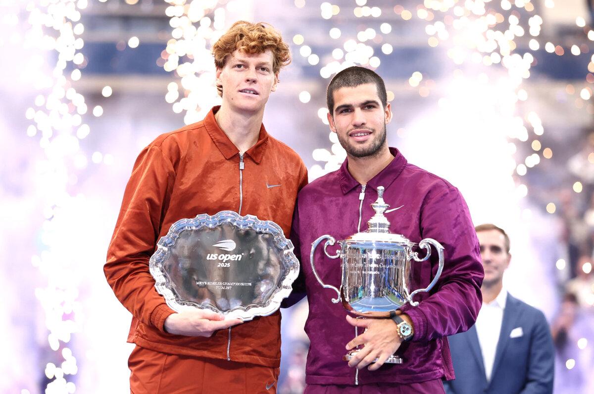 Carlos Alcaraz Wins US Open for 6th Slam Title 2 Spain's Carlos Alcaraz (R) and Italy's Jannik Sinner pose with their trophies after Alcaraz won the men's singles final tennis match on day fifteen of the U.S. Open tennis tournament at the USTA Billie Jean King National Tennis Center in New York City on Sept. 7, 2025. (Charly Triballeau/AFP via Getty Images)