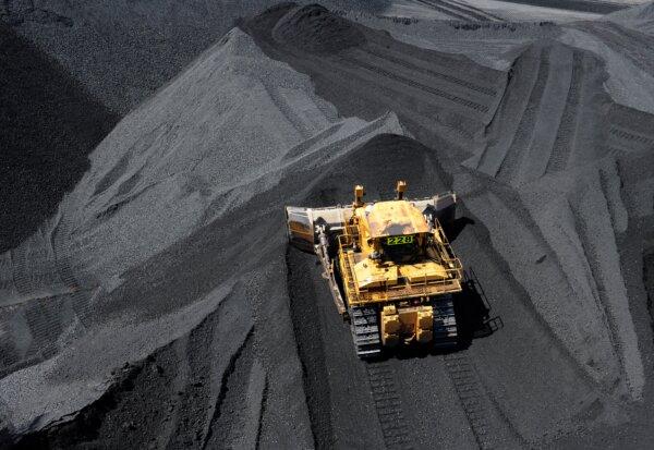 Coal is stockpiled before being loaded on to ships at the RG Tanner Coal Terminal in Gladstone in Queensland, Australia on Jan. 20, 2012. The Terminal plays a vital role in delivering coal supplies to foreign markets. (AAP Image/Dave Hunt)