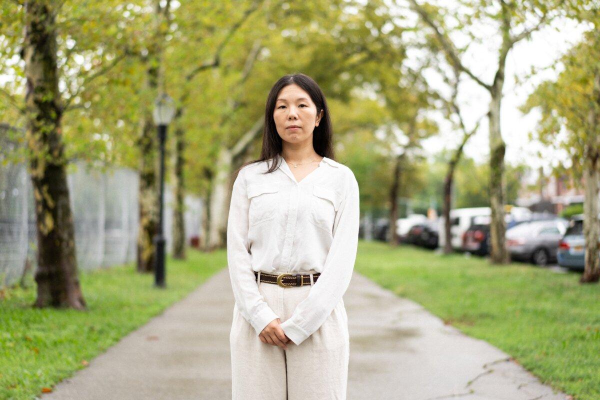 Han Yu, whose father, Han Junqing, a Falun Gong practitioner, was persecuted to death in China for his faith, stands on a street in New York City on Sept. 7, 2025.(Samira Bouaou/The Epoch Times)