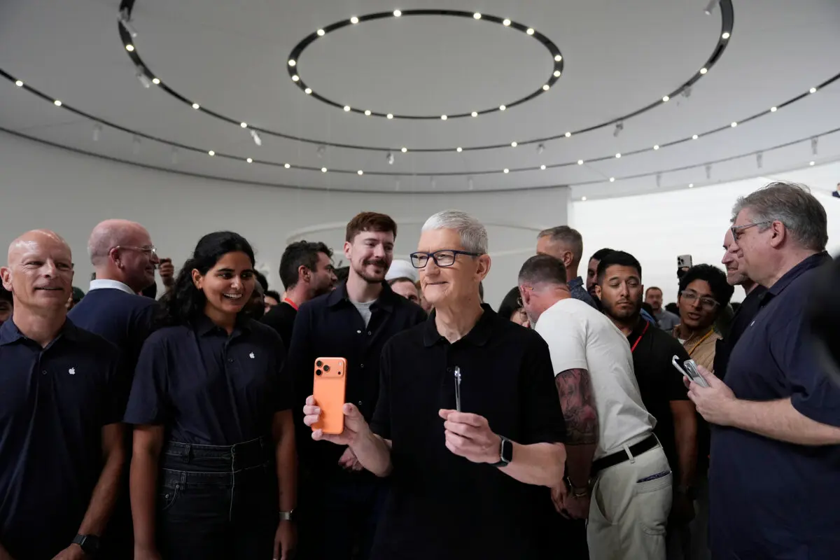 Nvidia Becomes First Company Ever to Cross $5 Trillion Market Cap | USNN World News Apple CEO Tim Cook holds new iPhones during an announcement of new products at Apple Park in Cupertino, Calif., on Sept. 9, 2025. (AP Photo/Godofredo A. Vásquez)