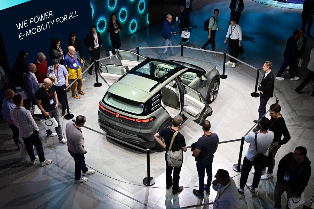 Visitors at the booth of the German car manufacturer Volkswagen on the opening day of the International Motor Show IAA, in Munich, on Sept. 9, 2025. (Tobias Schwarz/AFP via Getty Images)