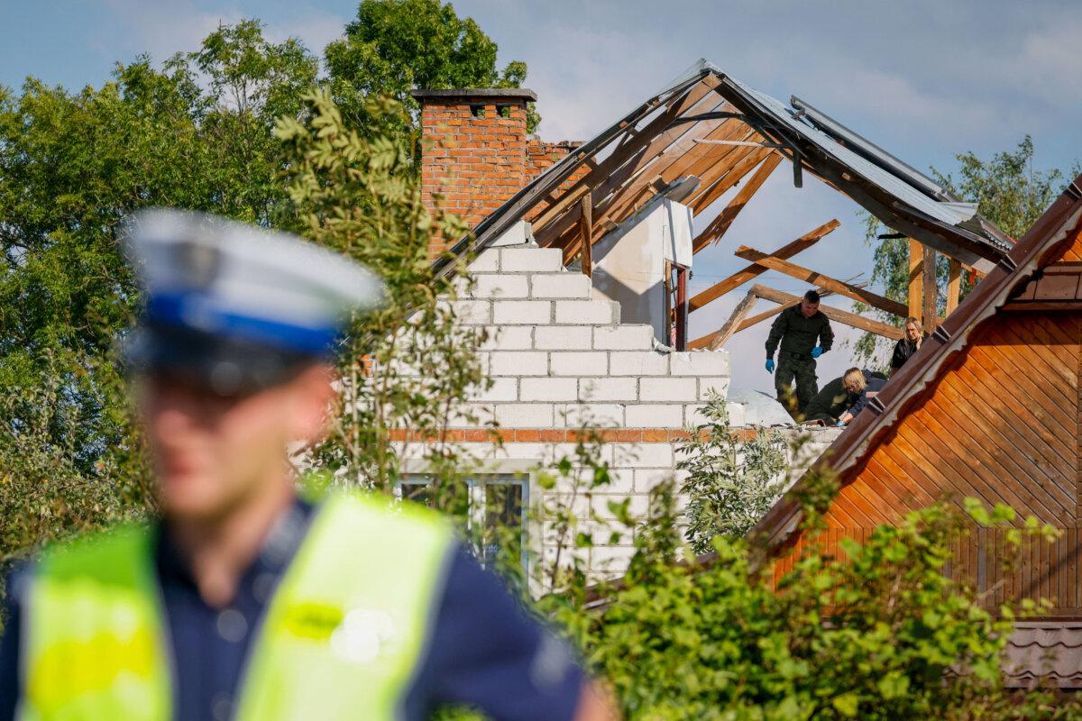 Police and army inspect damage to a house destroyed in the village of Wyryki-Wola, eastern Poland, on Sept. 10, 2025. (Wojtek Radwanski/AFP via Getty Images)