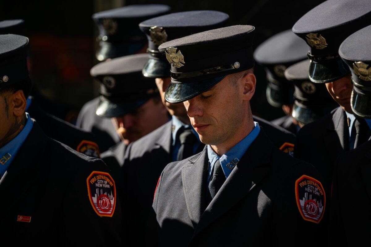 New York City firefighters participate in a moment of silence at a fire station near the National September 11 Memorial & Museum in lower Manhattan on the 24th anniversary of the 9/11 terror attacks, in New York City on Sept. 11, 2025. (Spencer Platt/Getty Images)