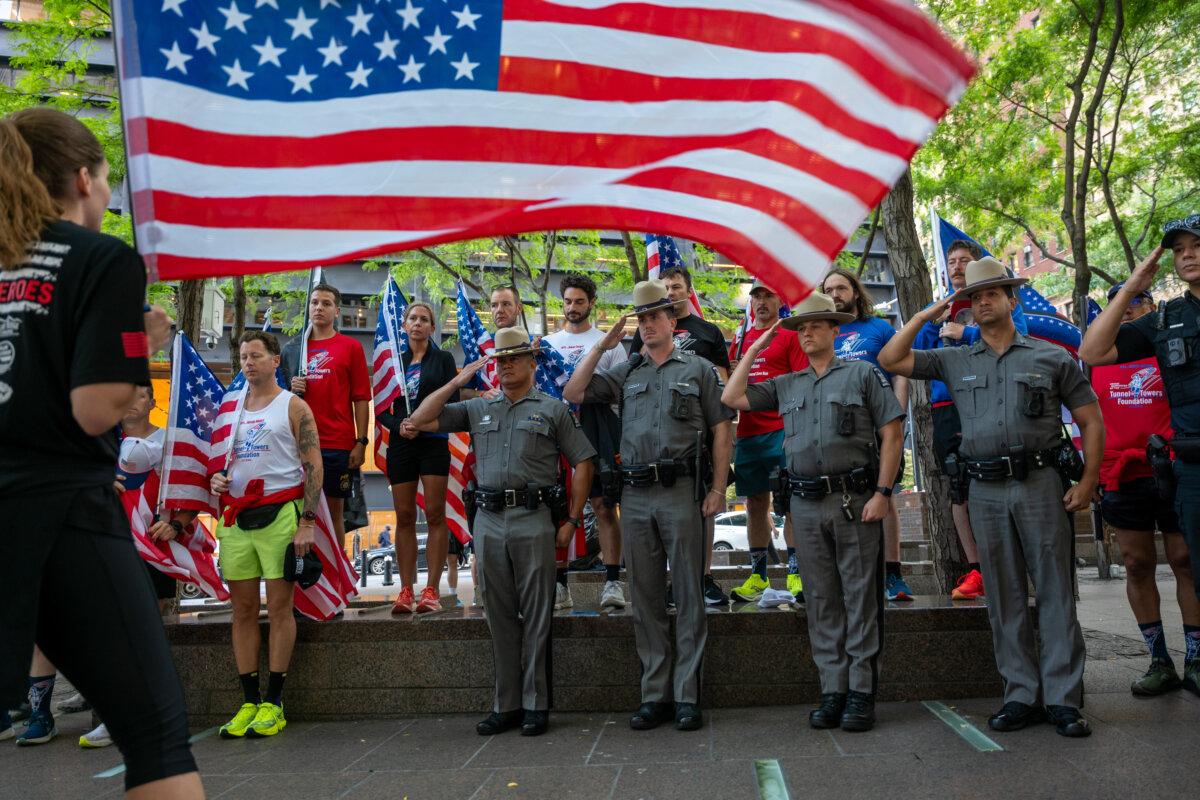 New York State Troopers and other law enforcement salute during a memorial service in lower Manhattan on the 24th anniversary of the 9/11 terror attacks, in New York City on Sept. 11, 2025. (Spencer Platt/Getty Images)