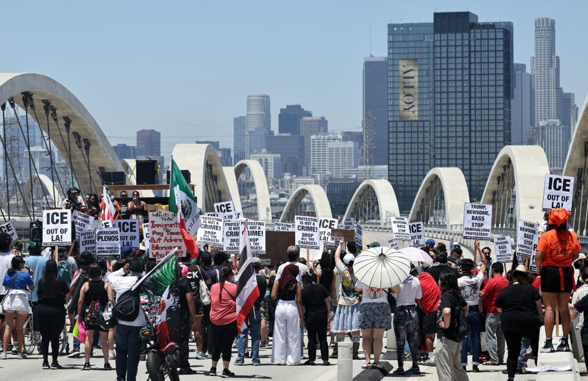Protestors demonstrate against ongoing ICE operations while blocking the Sixth Street Bridge between Boyle Heights and downtown L.A. in Los Angeles, on July 1, 2025. (Mario Tama/Getty Images)