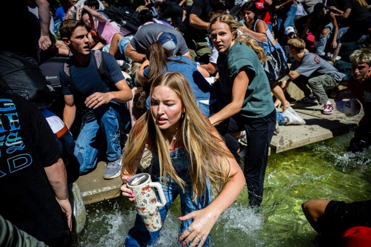 The crowd reacts after Charlie Kirk is shot during Turning Point's visit to Utah Valley University in Orem on Sept. 10, 2025. (Tess Crowley/The Deseret News via AP)