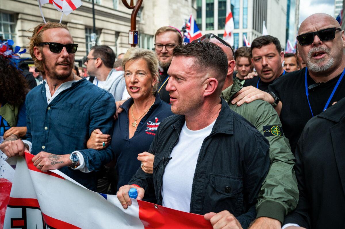 Laurence Fox (L), Katie Hopkins (C), and Tommy Robinson (R) attend the Unite The Kingdom rally in London on Sept. 13, 2025. (Ben Montgomery/Getty Images)