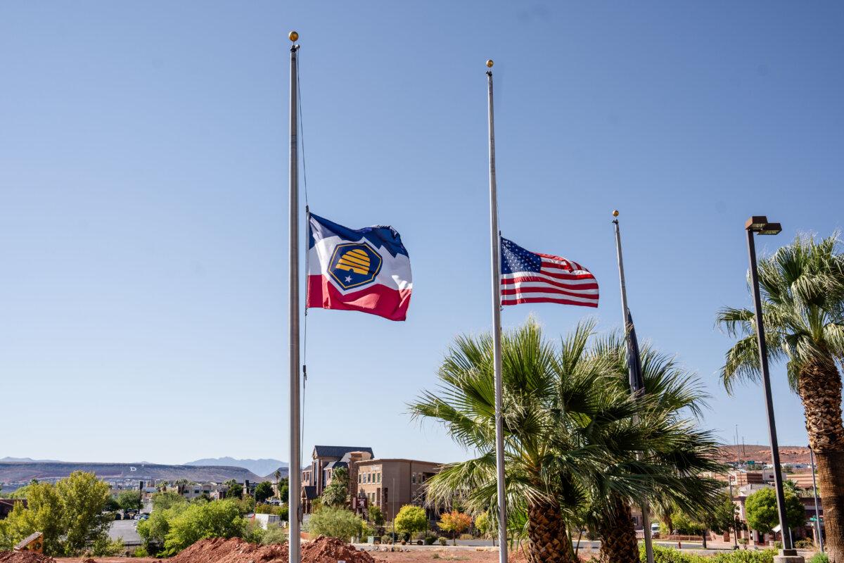 The Utah state flag and the American flag are lowered to half-staff in St. George, Utah, on Sept. 14, 2025. (Madalina Kilroy/The Epoch Times)