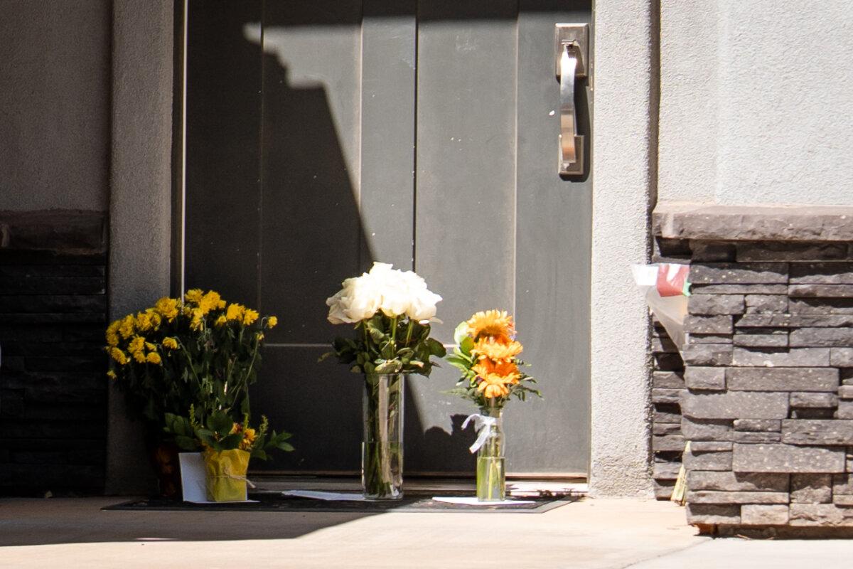 Flowers and cards expressing support for the family of Tyler James Robinson, the suspect in the slaying of Charlie Kirk, sit at the doorstep of his parents’ residence in Washington City, Utah, on Sept. 14, 2025. (Madalina Kilroy/The Epoch Times)