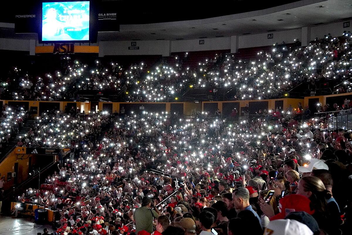 Thousands of cellphone lights flicker during a vigil for slain conservative youth leader Charlie Kirk in Tempe, Ariz., on Sept. 15, 2025. (Allan Stein/The Epoch Times)