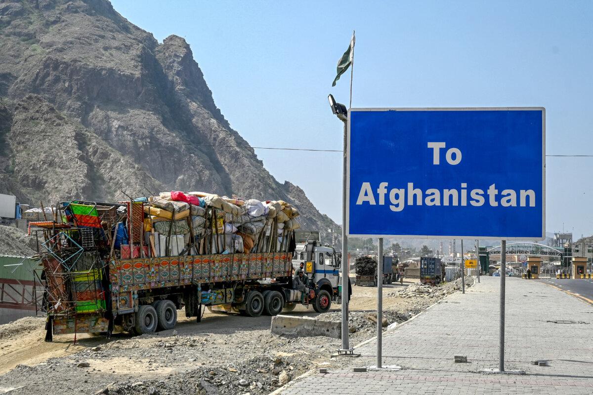 Afghan refugees with their belongings wait for deportation as they arrive in their trucks at the Pakistan-Afghanistan border in Torkham on Sept. 16, 2025. (Abdul Majeed/AFP via Getty Images)