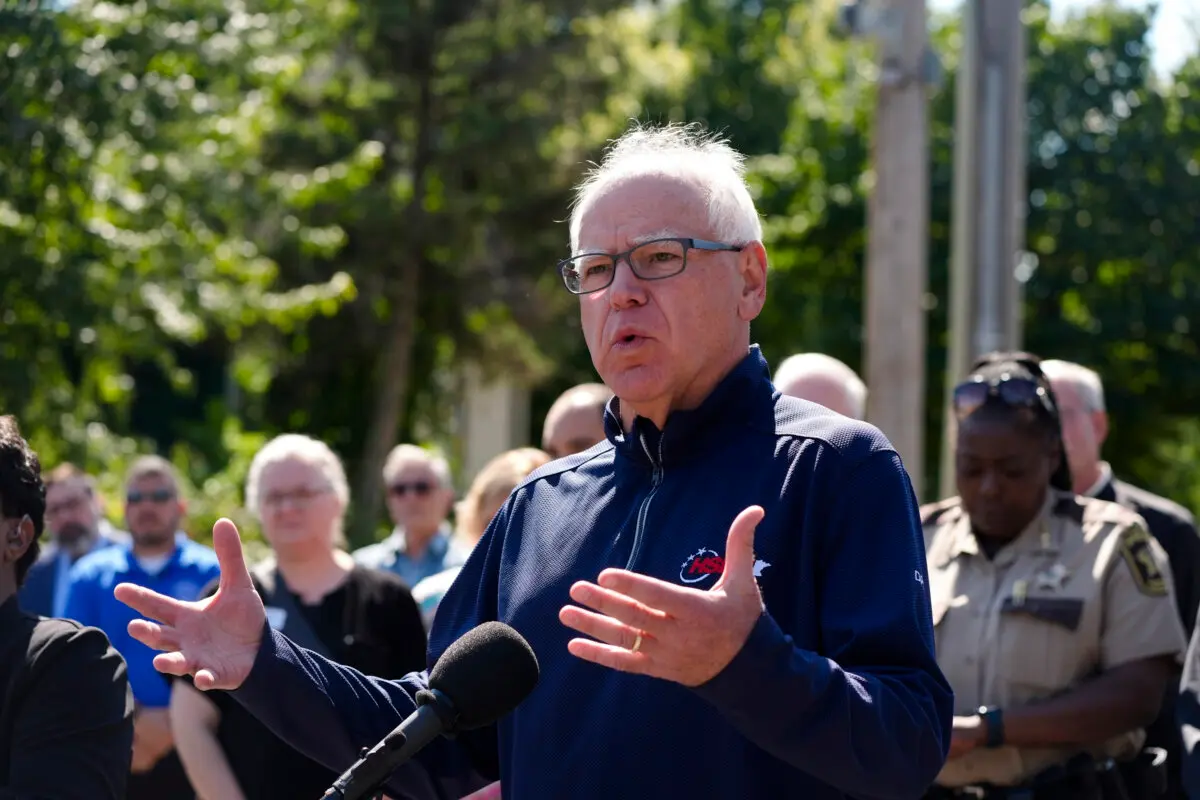 Oversight Committee Probes Alleged Cover-Up of Massive Minnesota Welfare Fraud | USNN World News Minnesota Gov. Tim Walz speaks outside the Annunciation Catholic School in Minneapolis on Aug. 27, 2025. (AP Photo/Bruce Kluckhohn)