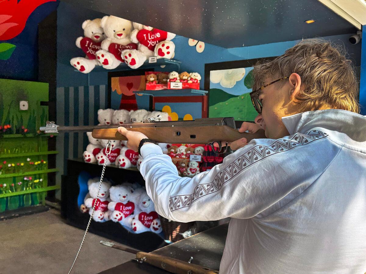 Ryan Behr in the shooting gallery of Tivoli Gardens. (Alan Behr/TNS)