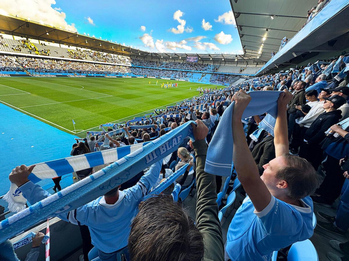 Malmo FF fans cheer for the team as they enter the field at the start of play. SK Sigma Olomouc, Eleda Stadion. (Alan Behr/TNS)