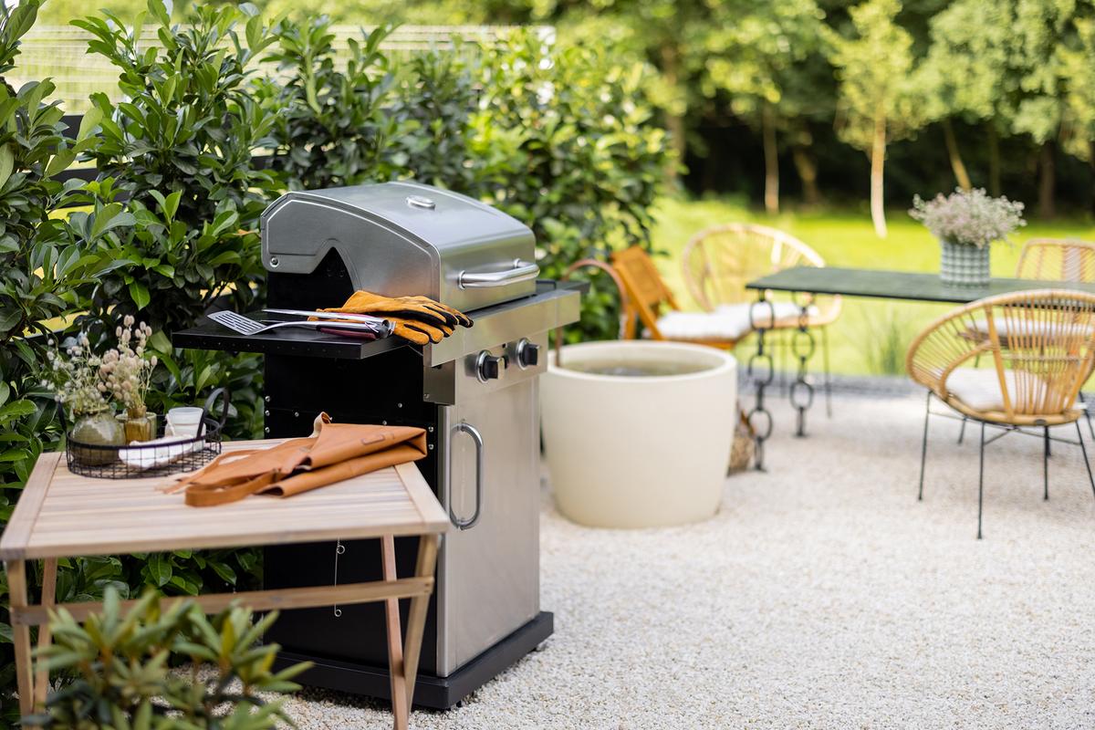 Make sure to care for your outdoor grill before storing it away for the winter. (RossHelen/Shutterstock)