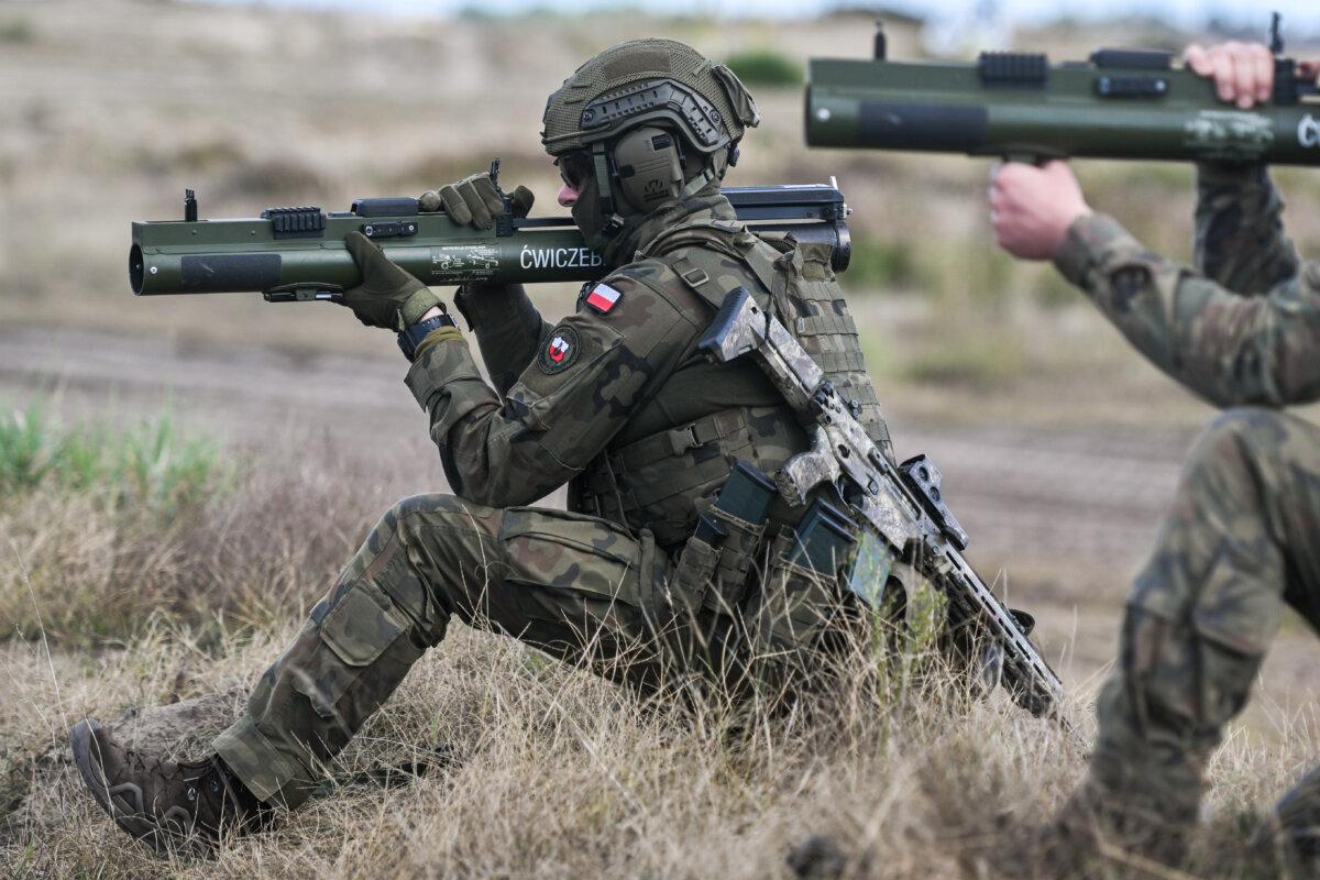 Soldiers of Poland's 3rd Podkarpackie Territorial Defense Brigade prepare a M72 anti-tank grenade launcher during the Iron Defender 25 media day in Nowa Deba, Poland, on Sept. 18, 2025 (Omar Marques/Getty Images)
