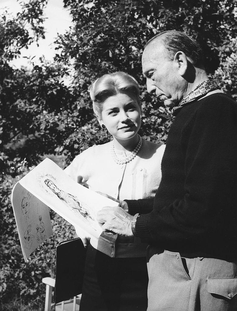 Dolores Hart and director Michael Curtiz, looking at sketches on the set of the film “Francis of Assisi,” 1961. (Pictorial Parade/Archive Photos/Getty Images)