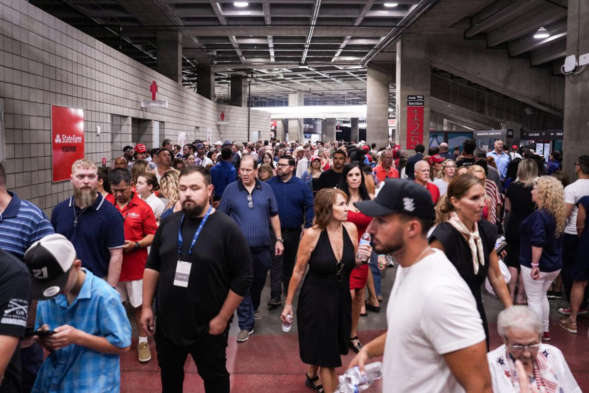 People arrive to take part in the Building a Legacy: Remembering Charlie Kirk Memorial event at the State Farm Stadium in Glendale, Ariz., on Sept. 21, 2025. (Madalina Kilroy/The Epoch Times)