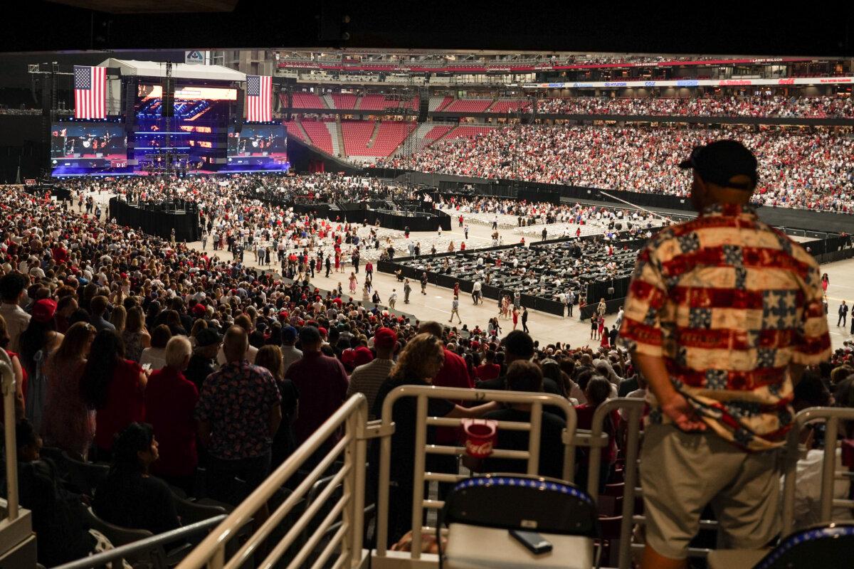 People attend Charlie Kirk's memorial event at the State Farm Stadium in Glendale, Ariz., on Sept. 21, 2025. (Madalina Kilroy/The Epoch Times)