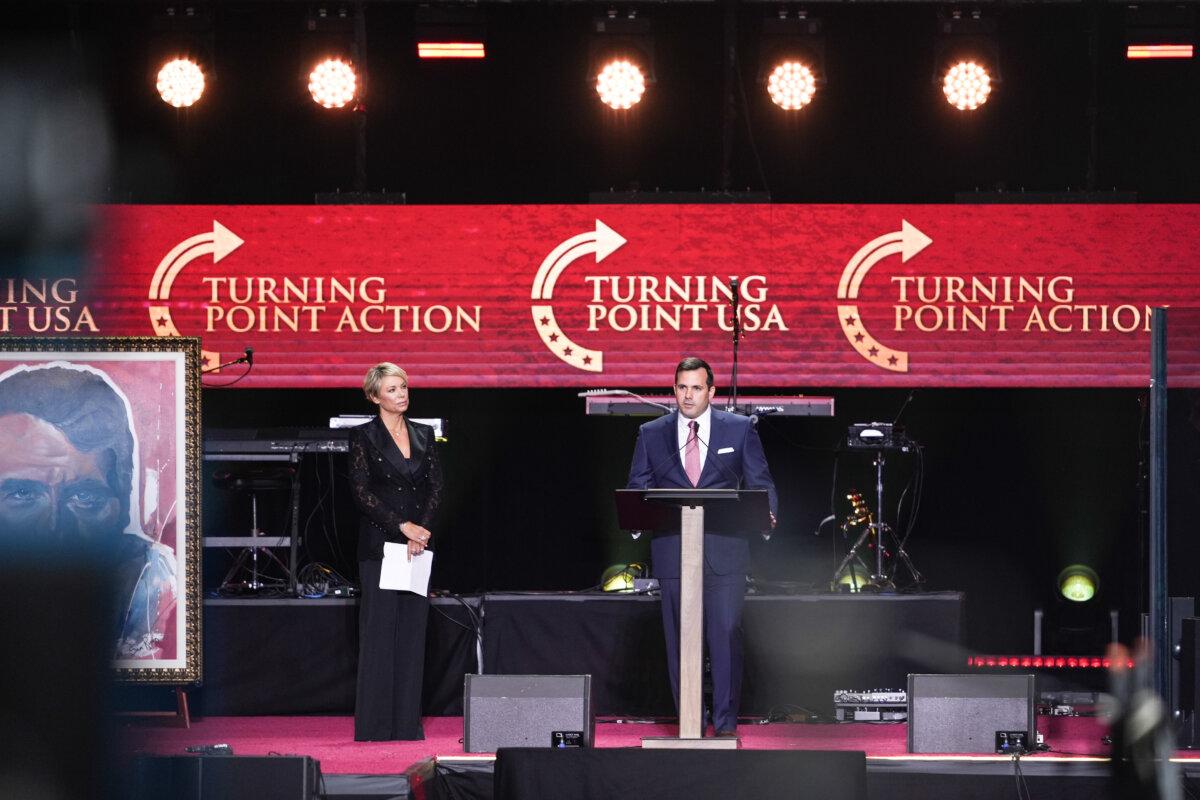 Turning Point USA COO and COO Justin Streiff speaks at the Building a Legacy: Remembering Charlie Kirk Memorial event at the State Farm Stadium in Glendale, Ariz., on Sept. 21, 2025. (Madalina Kilroy/The Epoch Times)