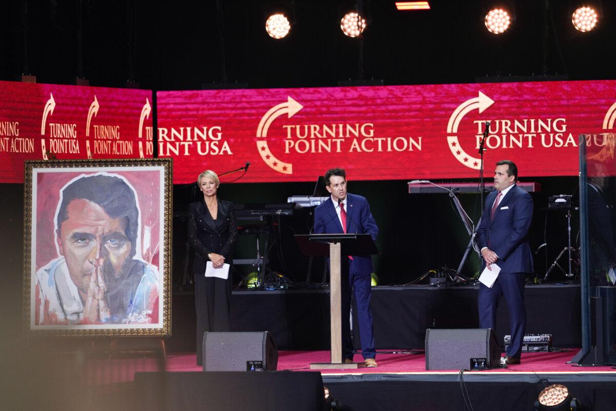 Turning Point USA COO Tyler Bowyer speaks at the Building a Legacy: Remembering Charlie Kirk Memorial event at the State Farm Stadium in Glendale, Ariz., on Sept. 21, 2025. (Madalina Kilroy/The Epoch Times)