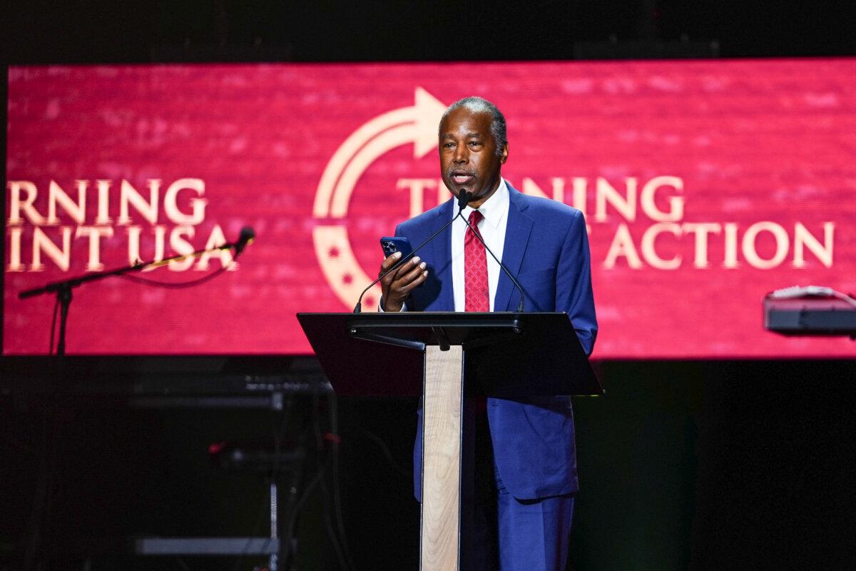 Former Secretary of Housing and Urban Development Ben Carson speaks at the Building a Legacy: Remembering Charlie Kirk Memorial event at the State Farm Stadium in Glendale, Ariz., on Sept. 21, 2025. (Madalina Kilroy/The Epoch Times)