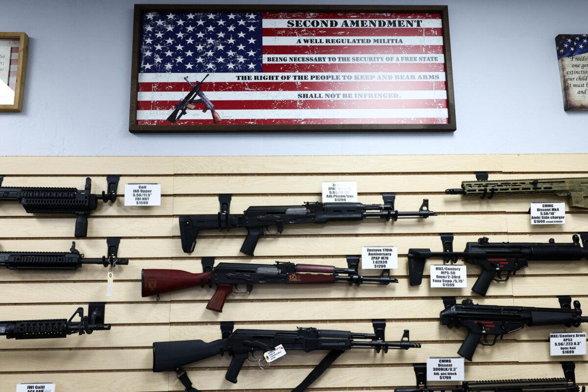 The second amendment is spelled on a U.S. flag above a display of firearms in a gun store in Rio Rico, Ariz., on Sept. 17, 2025. (Charly Triballeau/AFP)