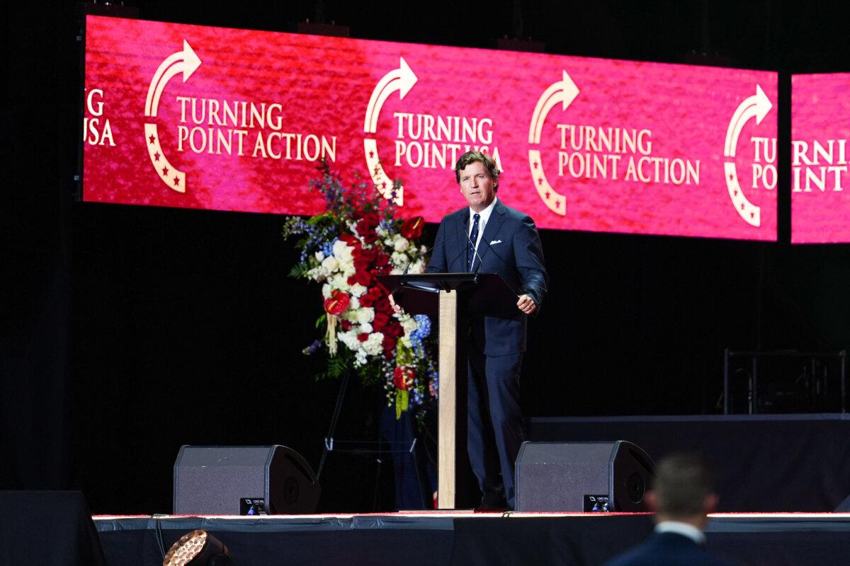 Political commentator Tucker Carlson speaks at the Building a Legacy: Remembering Charlie Kirk Memorial event at the State Farm Stadium in Glendale, Ariz., on Sept. 21, 2025. (Madalina Kilroy/The Epoch Times)
