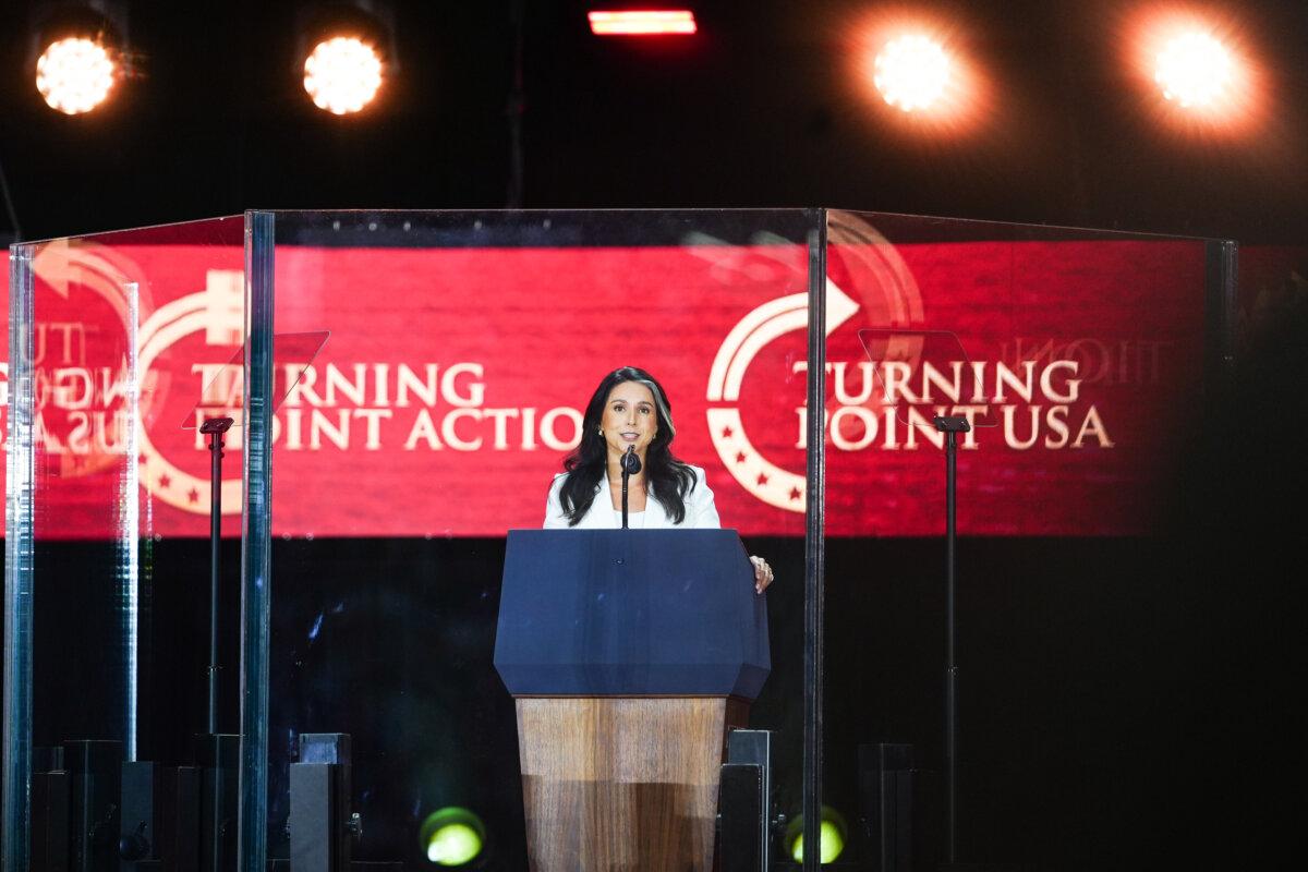Director of National Intelligence Tulsi Gabbard speaks at the Building a Legacy: Remembering Charlie Kirk memorial event at State Farm Stadium in Glendale, Ariz., on Sept. 21, 2025. (Madalina Kilroy/The Epoch Times)